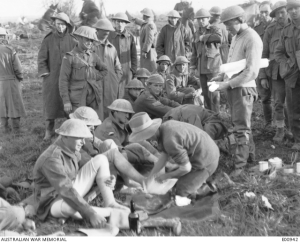 Members of the 40th Battalion, taking steps to address the problem of ‘trench feet’, after the Battle of Passchendaele, 1917 – Australian War Memorial E00942